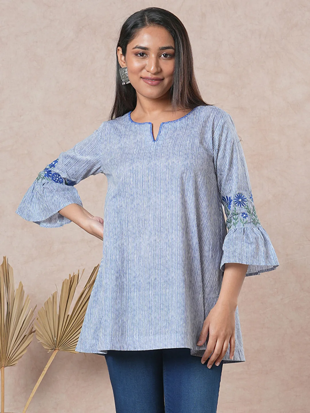 Flared printed cotton Tunic with machine embroidery on bell sleeve.